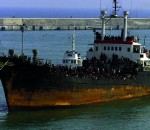 SOME 1,000 IMMIGRANTS WAIT TO LEAVE THE MONICA AFTER ARRIVING INCATANIA.